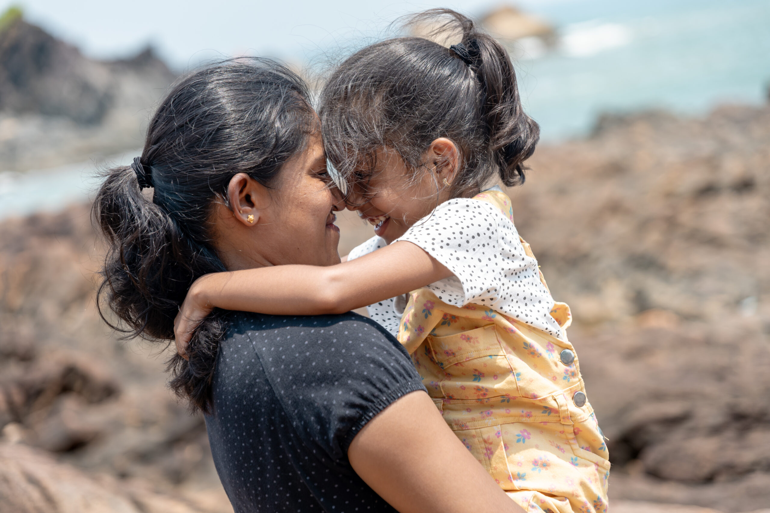 Seaside Serenity A Mothers Embrace by the Ocean